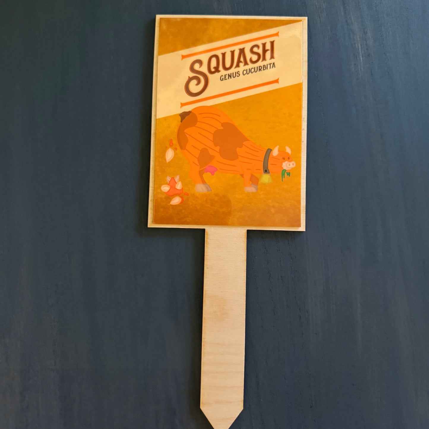 Image of Squash marker. Latin name: Genus Cucurbita. Cow horns, bell, hooves, udders, pooping Squash seeds out of it's gorde body.